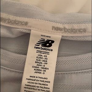 New balance t shirt size x small light blue colour